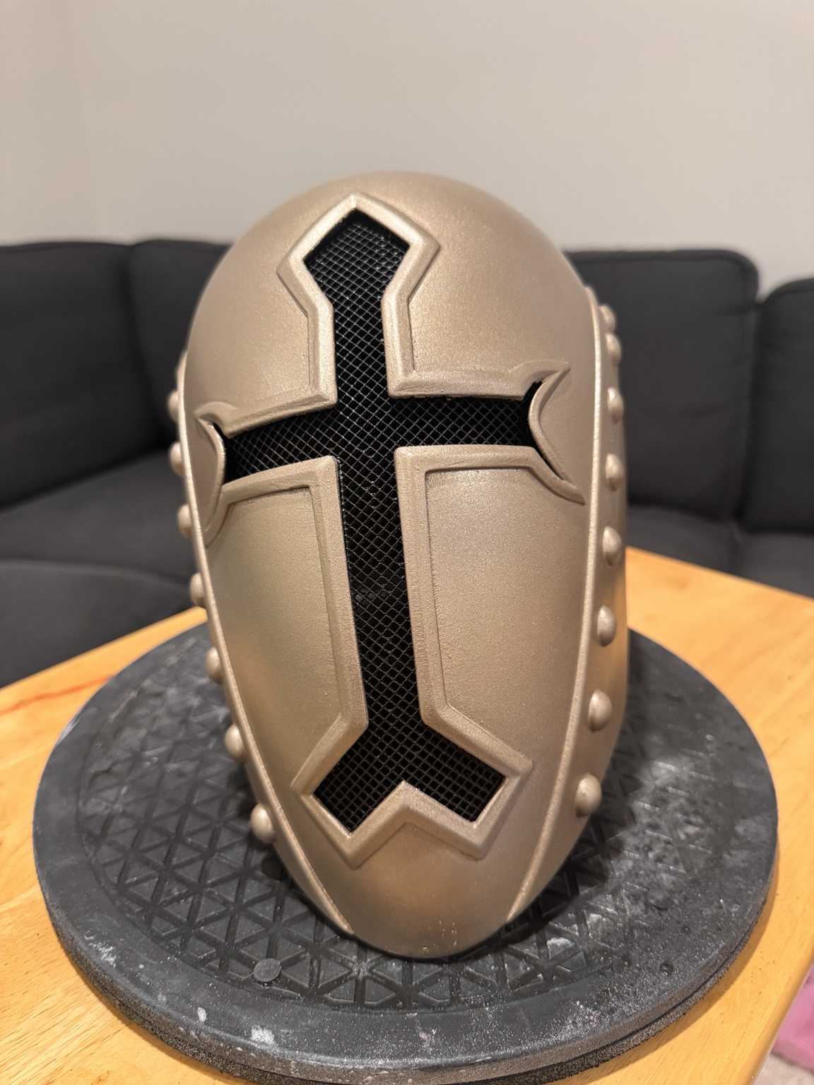 Gold Menoth Helmet with a black cross-shaped mesh visor