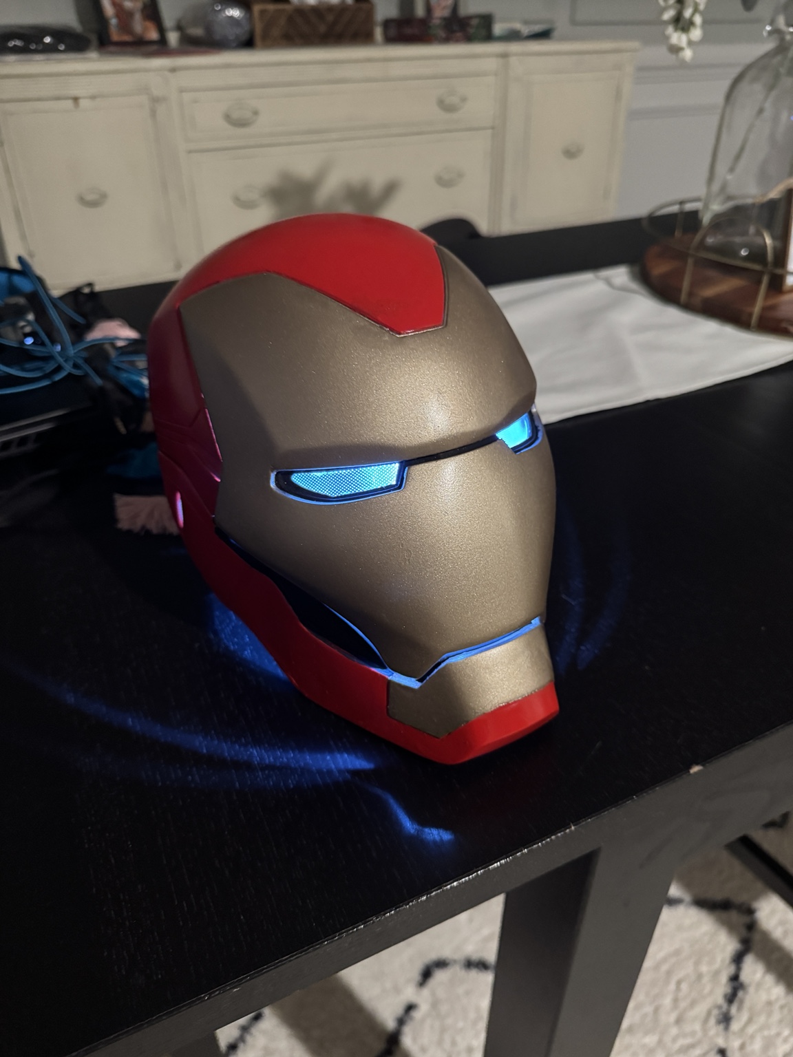 Red-and-gold Ironman Helmet with blue illuminated eyes