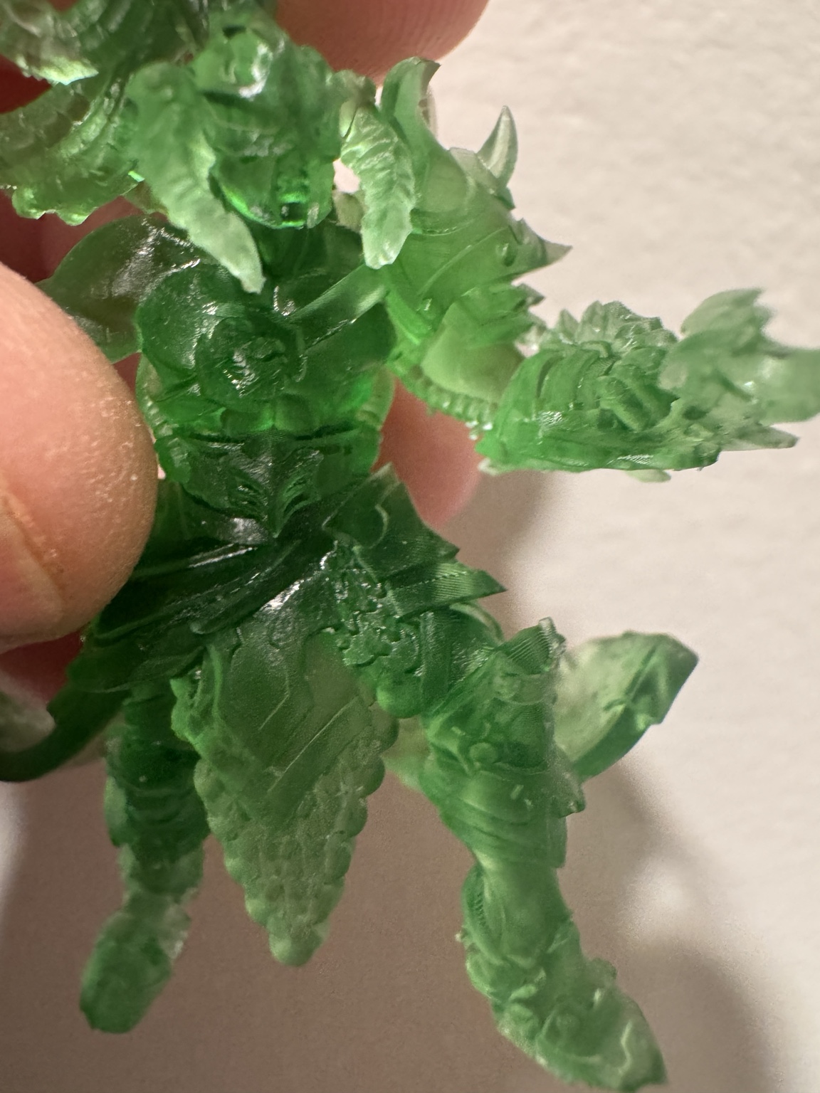 Close-up of a translucent green Dread Armada model
